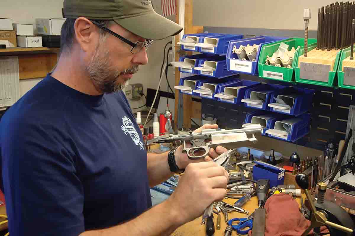 Ward Dobler checks an SD 76 action. Dobler was the shop foreman at Dakota Arms, where he worked for 30 years.